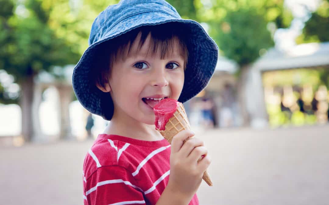 Boy eating strawberry ice crem